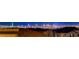 Enjoy an expansive and illuminated city view at night, overlooking neighboring rooftops at 180 Native Stone St, Las Vegas, NV 89138
