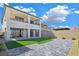 Modern two-story home with a private backyard, artificial turf, and a patio at 180 Native Stone St, Las Vegas, NV 89138