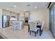 Bright kitchen featuring modern stainless steel appliances and an adjacent dining area at 180 Native Stone St, Las Vegas, NV 89138