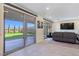 Living room features large glass doors that open to the backyard at 180 Native Stone St, Las Vegas, NV 89138