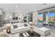 Bright, open-concept living room with modern finishes and seamless flow to the outdoor space at 180 Native Stone St, Las Vegas, NV 89138