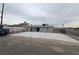 A large concrete pad in a fenced backyard, offering lots of potential at 2036 Canosa Ave, Las Vegas, NV 89104