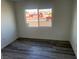 Clean, bright bedroom with hard surface floors, white walls, and a window at 2036 Canosa Ave, Las Vegas, NV 89104
