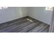 Bright bedroom with grey wood-look flooring, fresh white walls, and natural light at 2036 Canosa Ave, Las Vegas, NV 89104