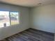 Neutral bedroom with new hard surface floors, white walls, and natural light at 2036 Canosa Ave, Las Vegas, NV 89104