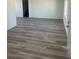 Bright living room featuring wood-style floors, fresh paint, and ample natural light at 2036 Canosa Ave, Las Vegas, NV 89104