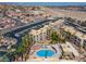 A high angle view shows the complex, the parking area and the community pool at 2048 Mesquite Ln # 303, Laughlin, NV 89029