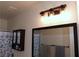 Bright bathroom features a large mirror, stylish vanity, and a decorative light fixture at 2048 Mesquite Ln # 303, Laughlin, NV 89029