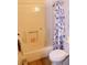 Bright bathroom featuring a shower-tub combination with a blue seashell-themed curtain at 2048 Mesquite Ln # 303, Laughlin, NV 89029