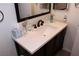 Bathroom vanity with a white countertop, dark wood cabinets, and stylish fixtures at 2048 Mesquite Ln # 303, Laughlin, NV 89029