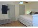Cozy bedroom boasts a ceiling fan, mounted TV, drawers and natural light, creating a tranquil and inviting personal space at 2048 Mesquite Ln # 303, Laughlin, NV 89029