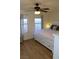 Bedroom with ceiling fan, storage bed, and windows at 2048 Mesquite Ln # 303, Laughlin, NV 89029