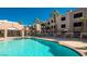 Community pool with lounge chairs and spa, adjacent to the clubhouse and apartment buildings at 2048 Mesquite Ln # 303, Laughlin, NV 89029