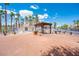 Outdoor community space with a picnic table, barbecue, and palm trees, perfect for gatherings at 2048 Mesquite Ln # 303, Laughlin, NV 89029
