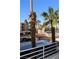Scenic community view with palm trees, parking, and nearby buildings on a clear day at 2048 Mesquite Ln # 303, Laughlin, NV 89029