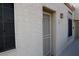 Side exterior showing a textured facade with a well-lit entrance and a window at 2048 Mesquite Ln # 303, Laughlin, NV 89029