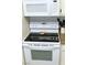 Clean white range and microwave combination in the kitchen at 2048 Mesquite Ln # 303, Laughlin, NV 89029