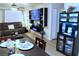 Open-concept space featuring a dining table, living area with a couch, and entertainment center at 2048 Mesquite Ln # 303, Laughlin, NV 89029