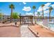 Picturesque community picnic area near the pool, with a pergola and desert landscaping at 2048 Mesquite Ln # 303, Laughlin, NV 89029