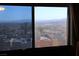 A picturesque view of distant mountains and buildings visible through the window at 2048 Mesquite Ln # 303, Laughlin, NV 89029