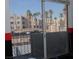 Exterior view from patio showcasing palm trees, building facades, and parking area at 2048 Mesquite Ln # 303, Laughlin, NV 89029
