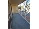 This is an exterior shot of the condo showing the private balcony overlooking the cityscape at 205 E Harmon Ave # 212, Las Vegas, NV 89169