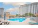 Enjoy a large, sparkling community pool with lounge seating, tables, and a cabana at 205 E Harmon Ave # 212, Las Vegas, NV 89169