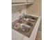 Updated kitchen sink featuring marbled countertops and stylish fixtures in a contemporary setting at 205 E Harmon Ave # 212, Las Vegas, NV 89169