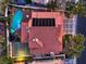 Expansive backyard with a large pool, basketball court, fire pit, and solar panels on the red-tiled roof at 2232 Barchetta Dr, Las Vegas, NV 89134