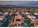 Aerial view featuring the home with a swimming pool, basketball court, and mountain views in the background at 2232 Barchetta Dr, Las Vegas, NV 89134