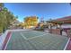 Backyard basketball court with outdoor kitchen, bar, grill and outdoor seating at 2232 Barchetta Dr, Las Vegas, NV 89134