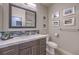Well-lit bathroom featuring a modern vanity, framed mirror, neutral walls and decor at 2232 Barchetta Dr, Las Vegas, NV 89134