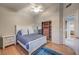 Bright bedroom featuring wood floors, a ceiling fan and an open closet with wood shelving at 2232 Barchetta Dr, Las Vegas, NV 89134