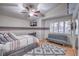 This charming bedroom boasts a ceiling fan and a window with shutters at 2232 Barchetta Dr, Las Vegas, NV 89134