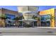 Entrance to Downtown Summerlin with palm trees and storefronts visible in a sunny view at 2232 Barchetta Dr, Las Vegas, NV 89134