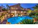 Beautiful home with covered patio and outdoor kitchen overlooking the pool at 2232 Barchetta Dr, Las Vegas, NV 89134