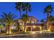 Stunning two-story home with a tile roof, attached two-car garage, and lush landscaping at 2232 Barchetta Dr, Las Vegas, NV 89134