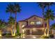 Charming two-story home boasts a tile roof, arched entryway, and a spacious two-car garage at 2232 Barchetta Dr, Las Vegas, NV 89134