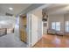 Hallway with carpet and wood floors, built in cabinets, and access to room with hardwood floors at 2232 Barchetta Dr, Las Vegas, NV 89134