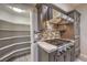 Well-equipped kitchen area with a stainless steel oven, gas cooktop, and organized pantry space at 2232 Barchetta Dr, Las Vegas, NV 89134