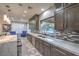 Bright kitchen with quartz countertops, stainless steel appliances, and a breakfast bar at 2232 Barchetta Dr, Las Vegas, NV 89134
