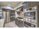 Modern kitchen equipped with stainless steel appliances, custom cabinets, and ample counter space at 2232 Barchetta Dr, Las Vegas, NV 89134