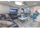 Spacious living room with a large sectional sofa, stylish rug, and comfortable seating arrangement at 2232 Barchetta Dr, Las Vegas, NV 89134
