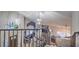 Open-concept living room with high ceilings, wrought iron railing, and lots of light at 2232 Barchetta Dr, Las Vegas, NV 89134
