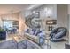 Open-concept living room with a soaring ceiling, wood-look flooring, a fireplace, and comfortable seating at 2232 Barchetta Dr, Las Vegas, NV 89134