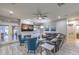 Bright living room featuring comfortable seating, wood-look tile, fireplace, and access to the backyard at 2232 Barchetta Dr, Las Vegas, NV 89134