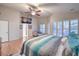 Well-lit bedroom with high ceilings, ceiling fan, and view of flat screen tv at 2232 Barchetta Dr, Las Vegas, NV 89134
