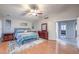 Large main bedroom with ceiling fan, soft rug, and a glimpse of the en suite bathroom at 2232 Barchetta Dr, Las Vegas, NV 89134