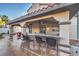Outdoor patio features a granite countertop bar, seating and an outdoor living space at 2232 Barchetta Dr, Las Vegas, NV 89134