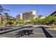 View of the Red Rock Casino Resort & Spa featuring a modern building and palm trees on a sunny day at 2232 Barchetta Dr, Las Vegas, NV 89134